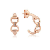 A pair of rose gold vermeil hoop earrings with cubic zirconia stones, designed to resemble a snaffle bit.